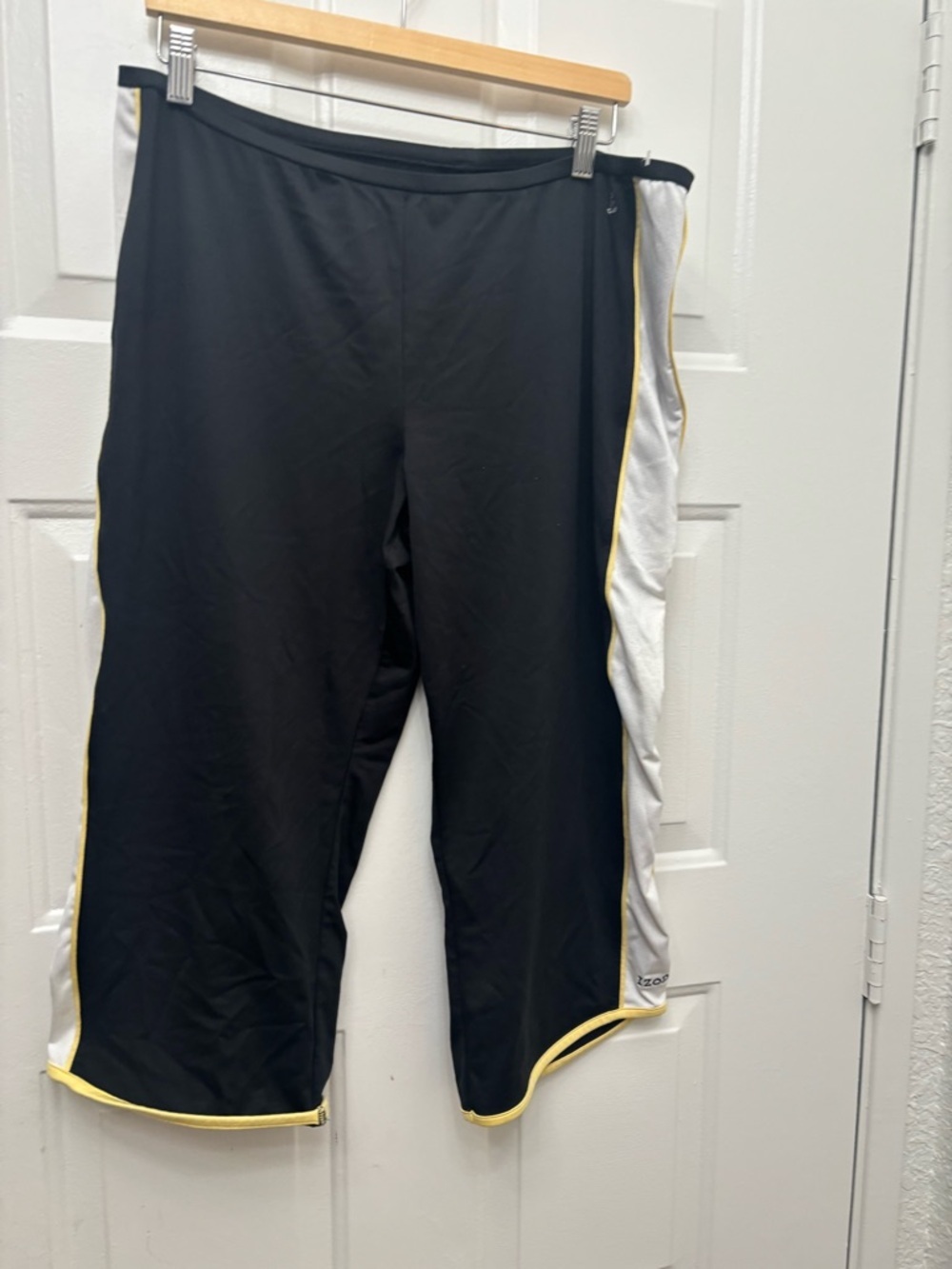 Izod Black Capris with White Side Panels and Yellow Trim